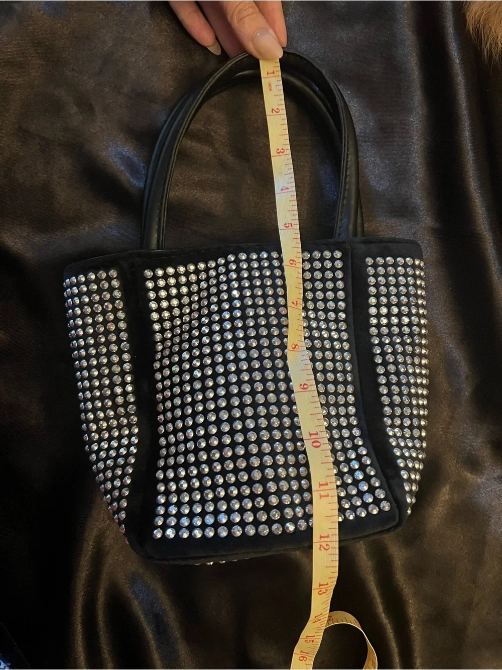 Fun and funky black and silver studded bucket bag. 80s and 90s studio 51 vibes!